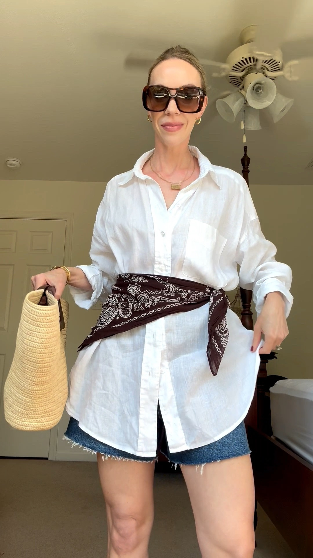Transitional outfit idea with oversized linen shirt, brown bandana scarf, denim shorts, straw tote bag

#LTKSeasonal #LTKOver40 #LTKSaleAlert