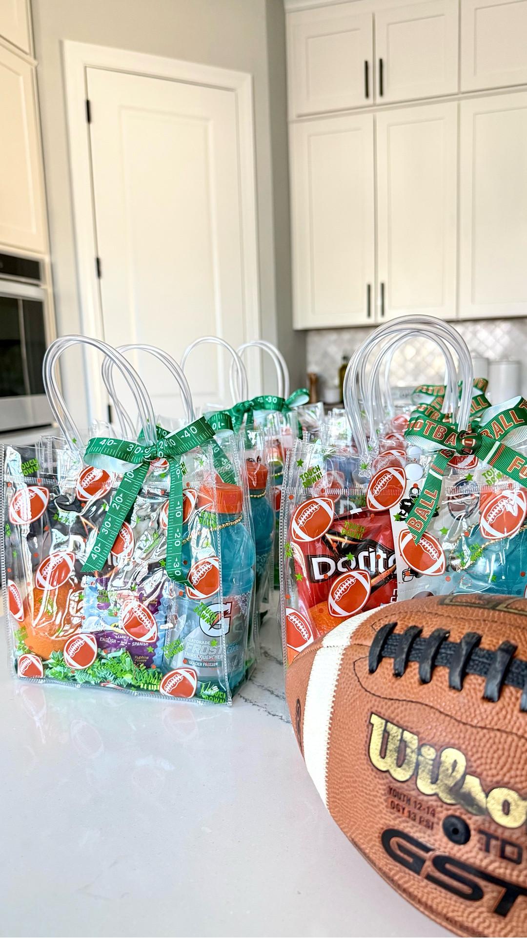Team snacks—but done better.
Same basics (Gatorade, fruit snacks, oranges, chips)… just swapped the paper bags for reusable football totes and added a few fun extras. Took 10 minutes and made everything feel way more put together.

Linked everything I used here for your next game day.

#LTKKids #LTKmomlife #LTKmorningroutine