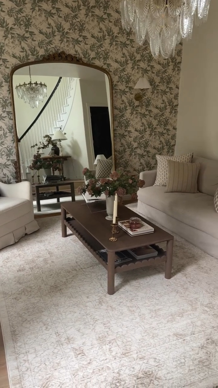 I feel like room desperately needed the change, what about you?! It’s so crazy to look back on the before listing photo and see how tiny this room looked. This room was once 2000’s French Tuscan and is now classic Nancy Meyers! Follow along @ourmountainsidehome_1 for more!  Before and after, living room, formal living room, classic home, collected home, wallpaper, Nancy Meyers home aesthetic.  #beforeandafter #nancymeyersinteriors #livingroom #classichome #homedesign