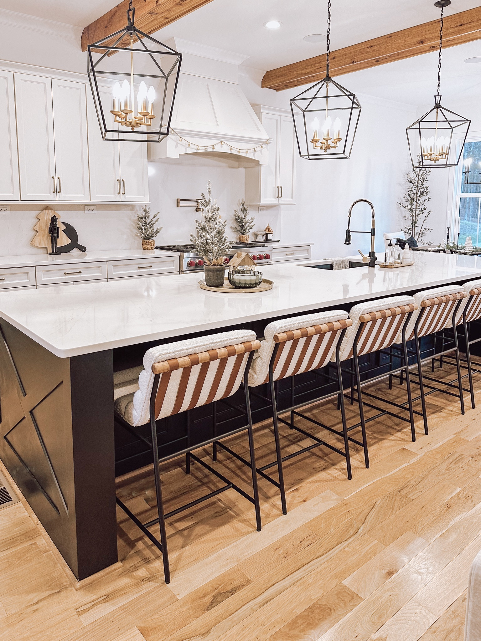 Holiday kitchen decor, black kitchen pendants, gold tray, flocked Christmas tree decor, gold house, Christmas candle, tree serving board, black nutcracker decor 

#LTKFindsUnder50 #LTKHome #LTKHoliday