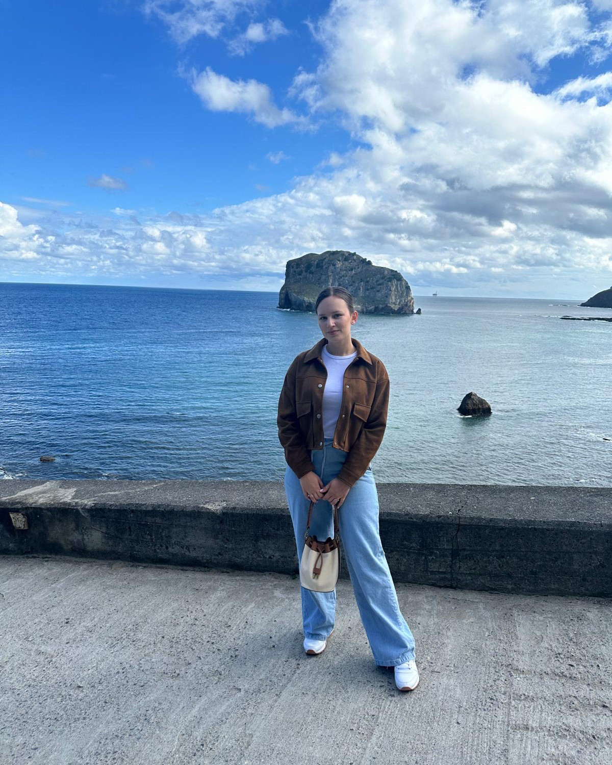 Denim flowy pants suade jacket white tee with white Reebok classic sneakers 

#LTKFindsUnder100 #LTKTravel #LTKU