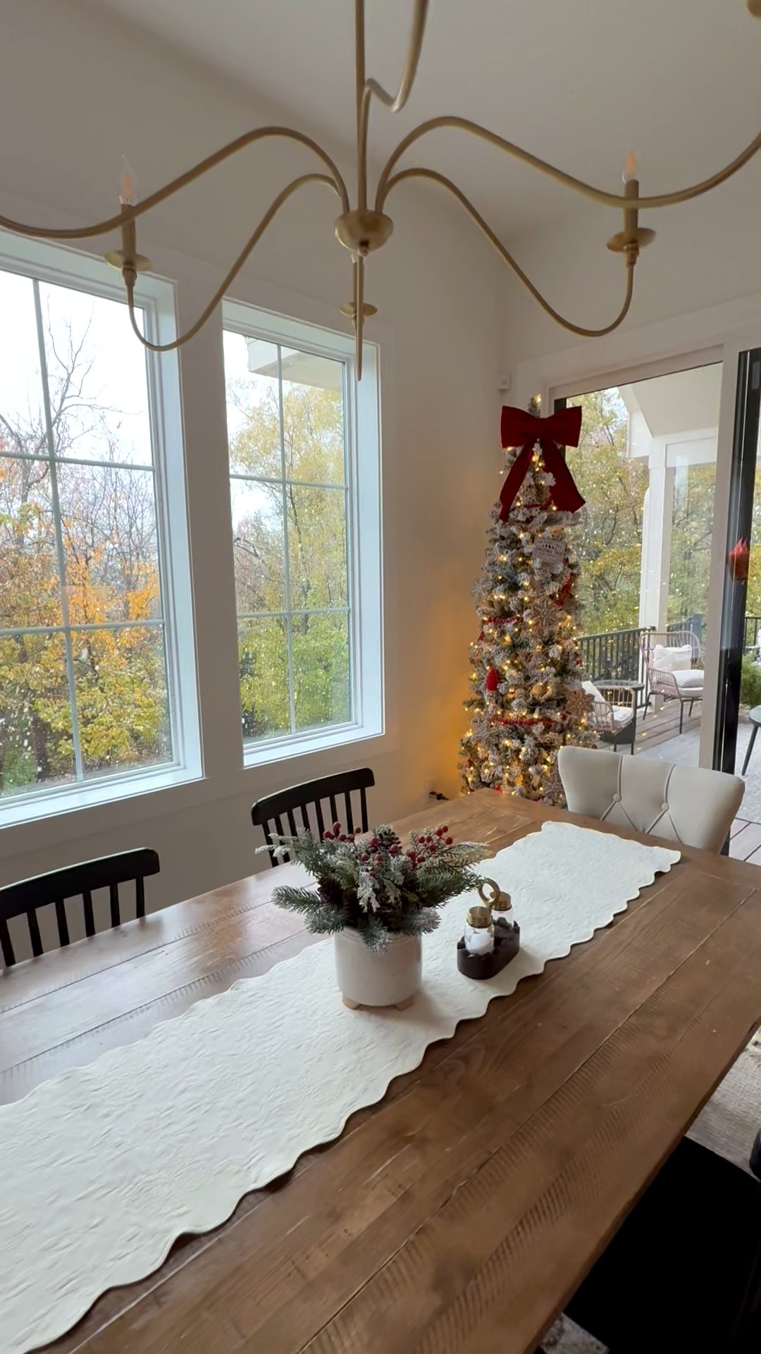 White flocked pencil tree with red bows and gingerbread ornaments! Black dining table chair! 

#LTKHome #LTKHoliday #LTKSeasonal
