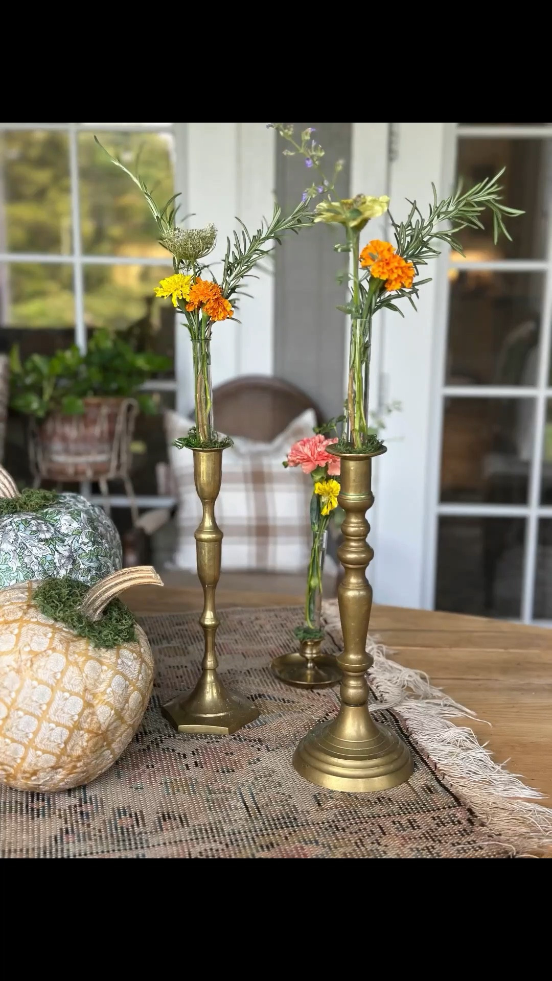 I found these test tube vases at an estate sale a couple of years ago and have never used them. 

I realized recently that they fit perfectly inside a taper candlestick.

I used moss inside the hole of my brass candlesticks to help secure the vases.

They turned out to be such a cute and unusual flower vase.

#LTKFindsUnder50 #LTKStyleTip #LTKHome