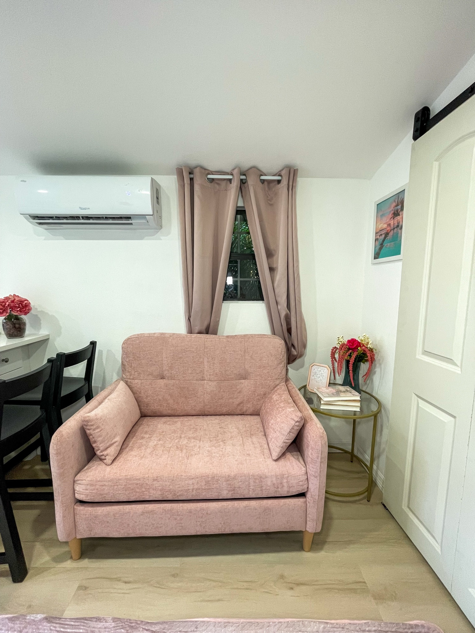 A soft blush living area made for lounging after a day exploring Fort Myers.