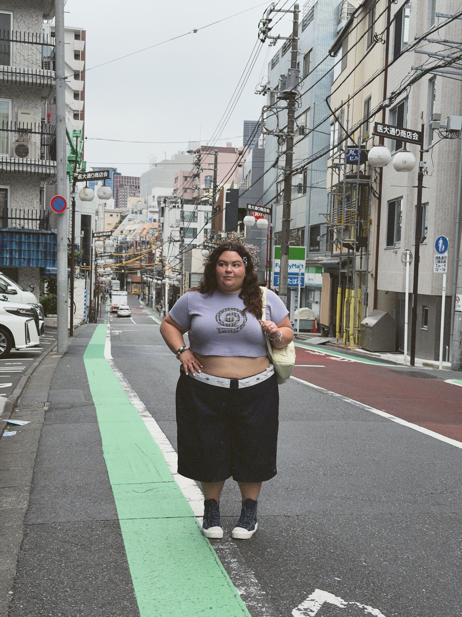 what I wore in Tokyo, Japan as a plus size woman. 
I got this entire outfit from Luvsick Plus (a vintage store in Chicago)
- shorts: Dickies extra loose
- baby tee: Big Bud Press (upcycled) 
- sneakers: Marc Jacobs 
- backpack: Dagne Dover

#LTKootd #LTKMidsize #LTKPlusSize