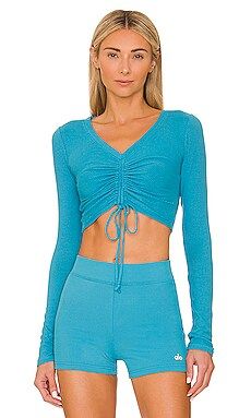 alo Ribbed Cropped Cinch Long Sleeve in Blue Splash from Revolve.com | Revolve Clothing (Global)