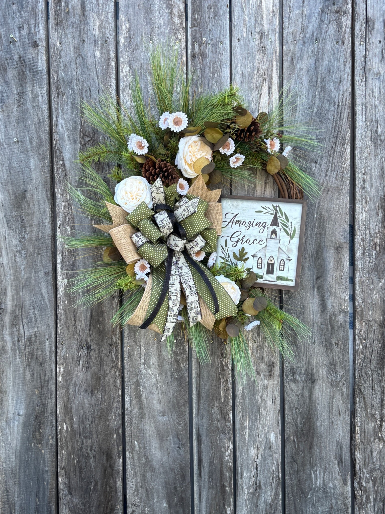 ✨ Amazing Grace ✨
There’s just something special about a wreath that speaks peace before you even open the door. This beauty is filled with soft pines, pinecones, creamy blooms, and the sweetest “Amazing Grace” sign — perfect for Christmas, winter, or year-round inspiration .

#LTKSeasonal #LTKU #LTKautumn