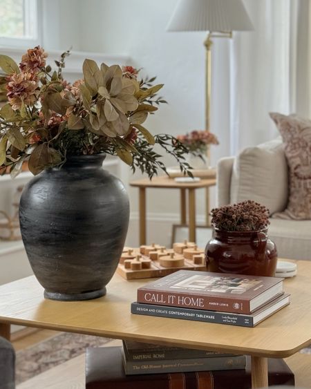 A few ways to get my coffee table look here - faux florals, wooden tabletop games and design books for a romantic touch!

#LTKhome #LTKSeasonal