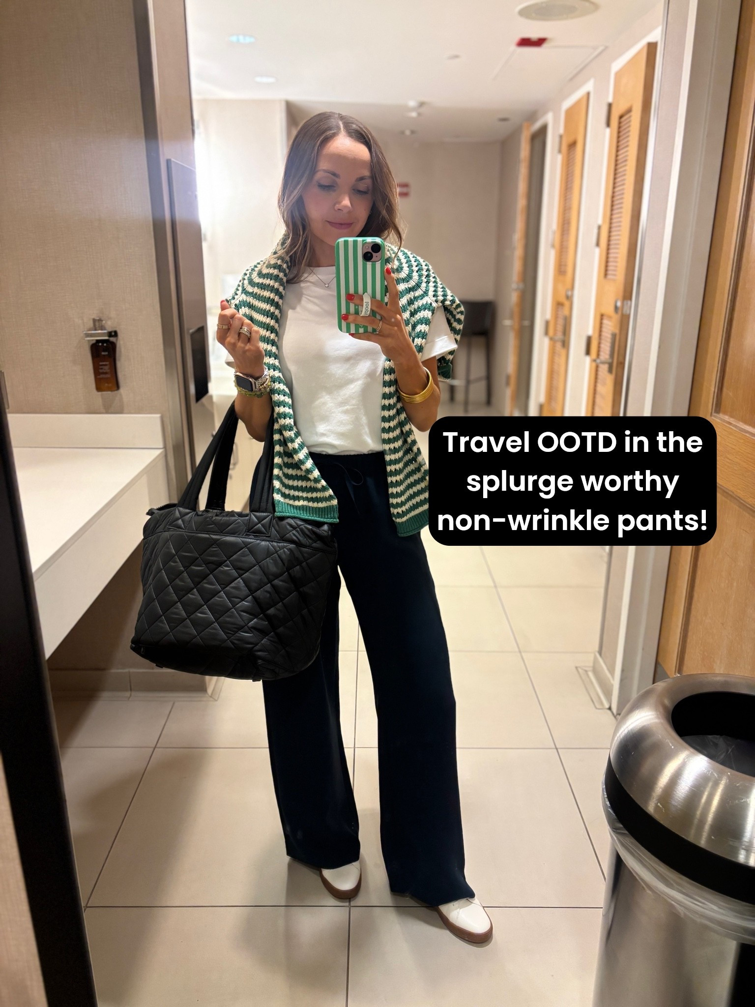 Today’s travel fit in the viral non wrinkle pants, the best travel tote that holds everything, and sneakers that are comfy and have arch support.