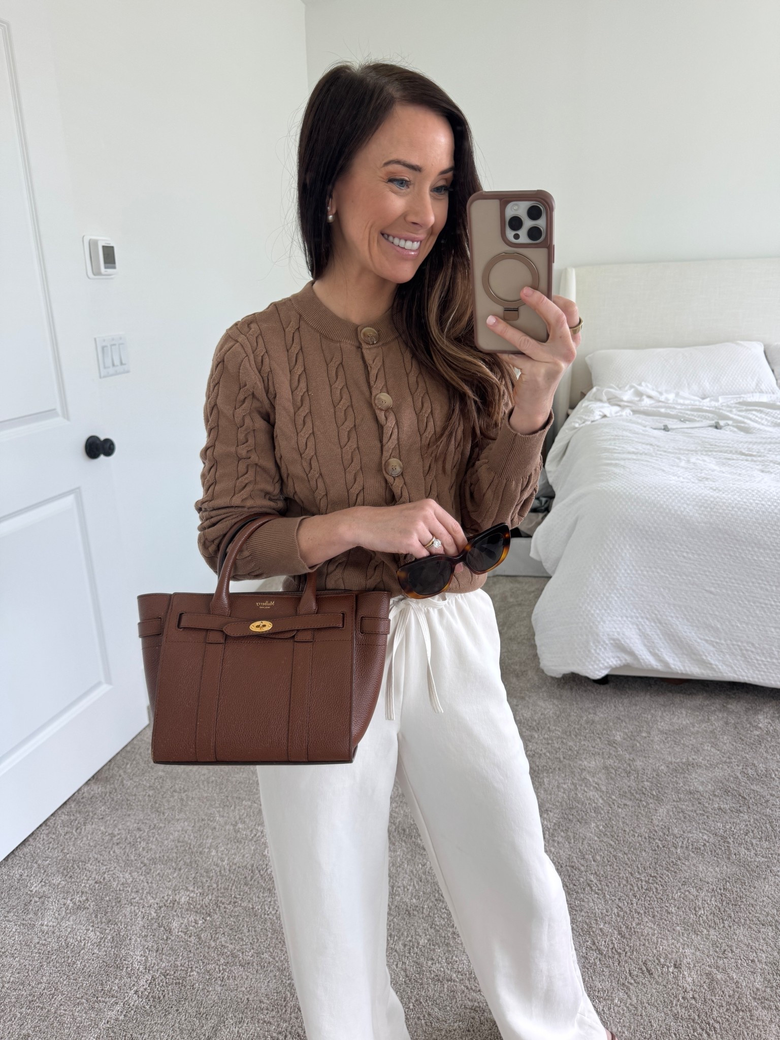 brown cable knit sweater, aritzia crepe lodge pant, white lodge pant, travel outfit, brown handbag, mulberry handbag

#LTKOver40