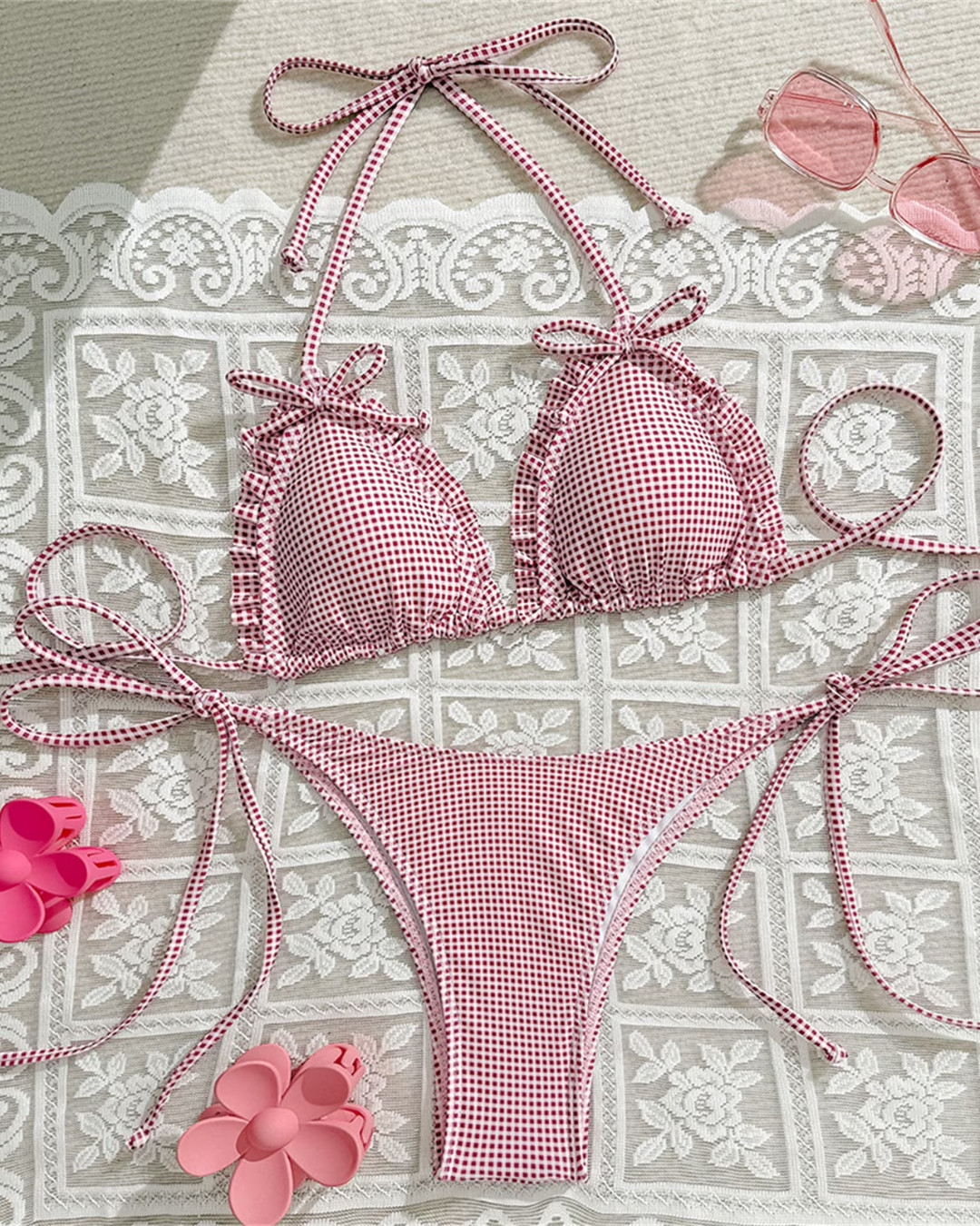 This pink gingham bikini is giving all the feminine, flirty summer vibes! 💕 The ruffle details, adjustable tie straps, and classic gingham print make it such a fun swimsuit for beach vacations, pool days, and tropical getaways. It's one of those timeless swimsuits you'll reach for year after year.

✨ Shop this pink gingham bikini, cute swimwear, and my favorite affordable summer finds on my LTK! 

 #LTKSeasonal #LTKSwim