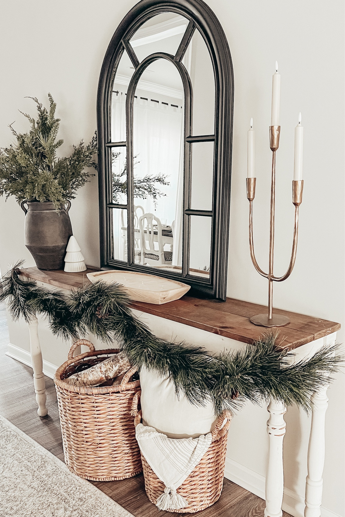 Simple entryway table for Christmas. I’ve decide to go with a lot of natural texture and greens this year. I love how it can carry through all winter long and I get to enjoy it more! 🌲 


#entryway #Entrywaytable #entrywaydecor #consoletable #vase #vessel #candle #candelabra #batteryoperatedcandles #baskets #thowbkanket #rug #frontentry #honedecor #neutraldecor #ltkhomedecor

#LTKHoliday #LTKhome #LTKSeasonal