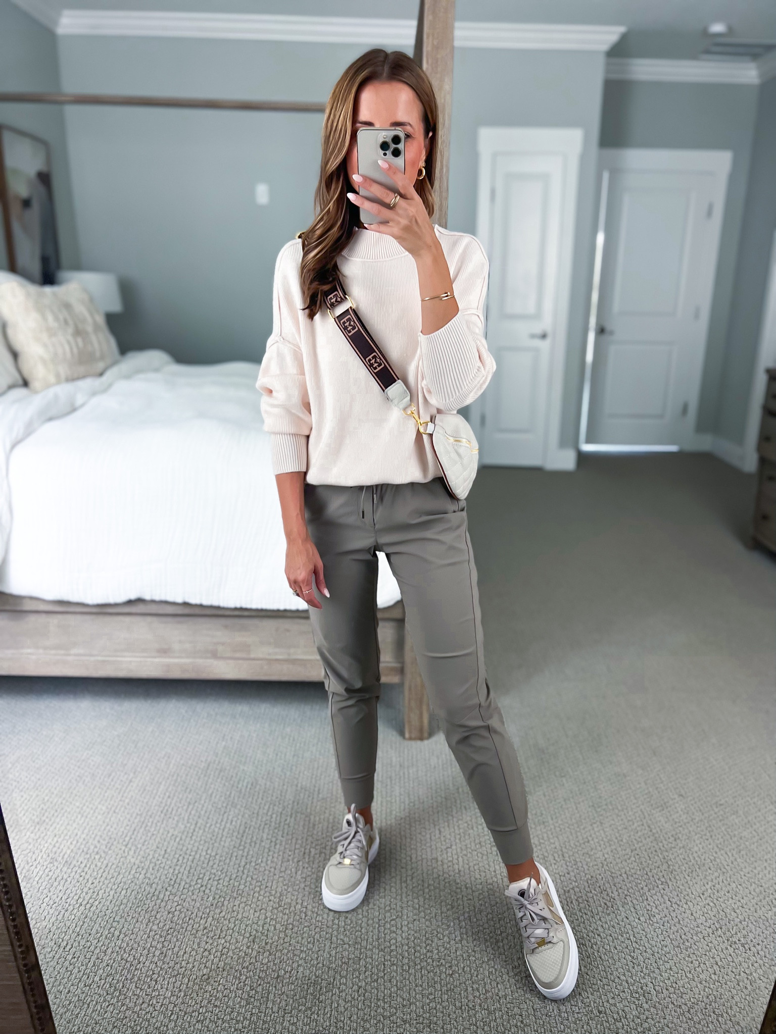 Amazon jogger outfit. Travel outfit. Airport outfit. Fall outfit. Amazon joggers (XXS, cliff ash). Cream Amazon sweater (small). Nike court vision Alta (TTS, size up if you are sometimes in between sizes). Casual outfit. Fall outfit. Amazon quilted belt bag. Bedroom. Pottery barn canopy bed. 