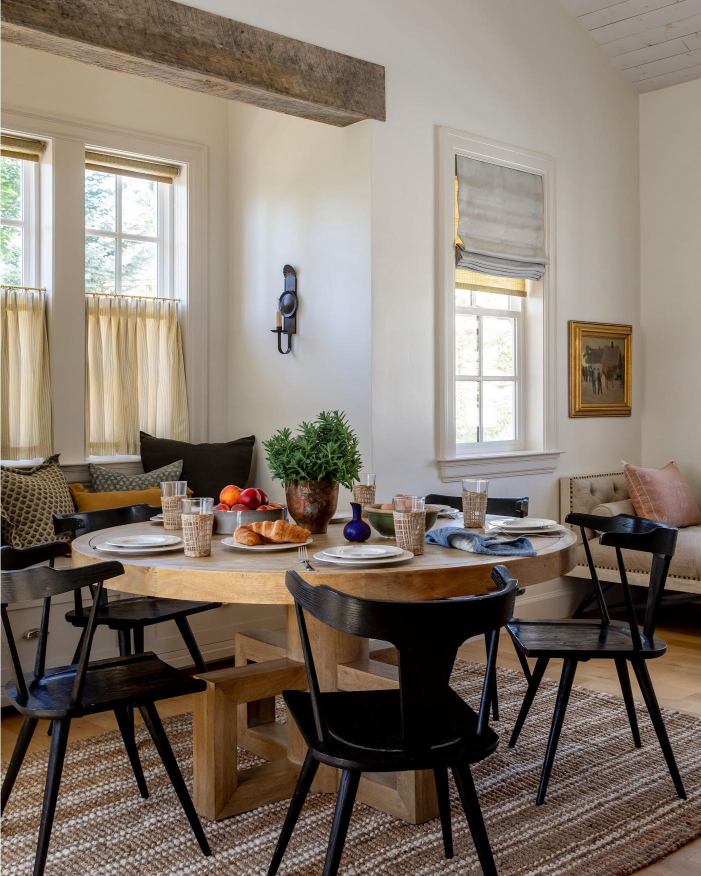 Breakfast Room – Warm Neutrals & Architectural Detail

Soft neutrals + natural wood textures create the coziest morning nook 🤍

A vaulted pine shiplap ceiling and custom banquette layered with pillows make this space feel intimate and inviting.

Design: @scarlettdesignfirm
Photography: @lindsay_salazar_photography

Walls: Benjamin Moore Bone (50% lighter)
Trim: Benjamin Moore Bone (50% darker)

Shop this space:
• Round walnut dining table
• Black wood chairs
• Striped jute rug
• Café curtains

Save this breakfast nook idea ✨

Full tour: https://www.homebunch.com/take-a-tour-through-this-french-country-inspired-mountain-home/

#BreakfastNook #FrenchCountryStyle #NeutralInteriors #HomeBunch

#LTKHome #LTKmomlife #LTKmorningroutine