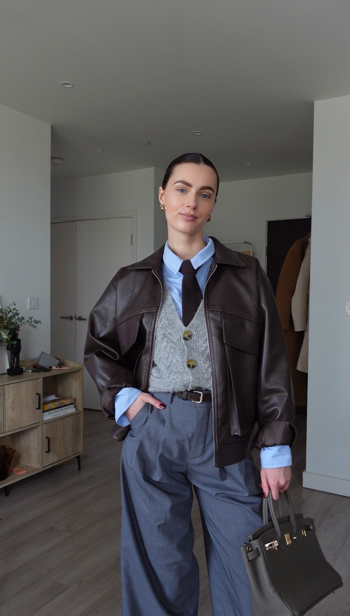 Blue shirt with grey trousers and leather jacket 

#LTKspring #LTKeurope #LTKuk