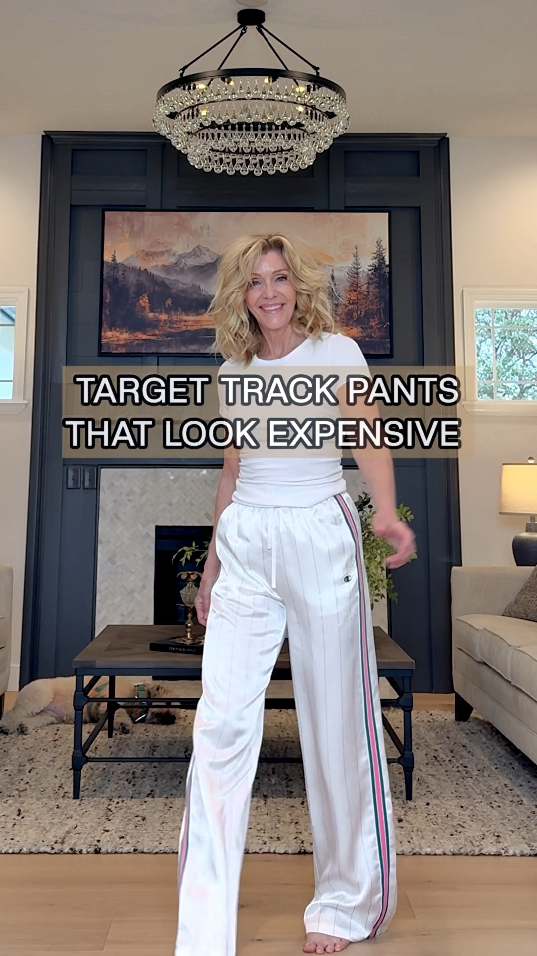 These $40 Target pinstripe track pants look way more expensive than they are.

Silky, lightweight, and just enough sheen to elevate them beyond typical loungewear. The drape is what makes these—fluid, not bulky—so they read polished.

I styled them here from basic to elevated to show the difference a few intentional swaps make. Same pants, completely different energy.

✔️ relaxed elastic waist (comfortable but still flattering)
✔️ longer length (I’m in platforms here for a clean line)
✔️ easy to dress up or down depending on shoes + top

Honestly, these are a great travel piece too—comfortable like lounge, but they don’t look like you gave up.