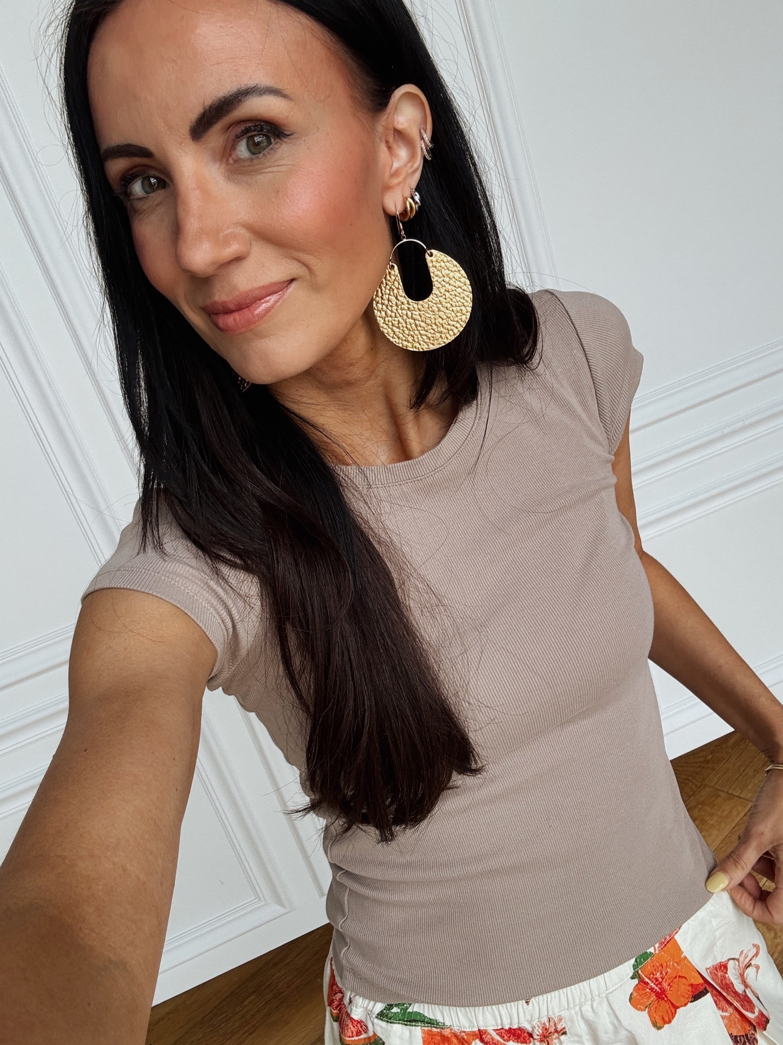 These gold statement earrings are Italian leather- super lightweight even though they are huge!