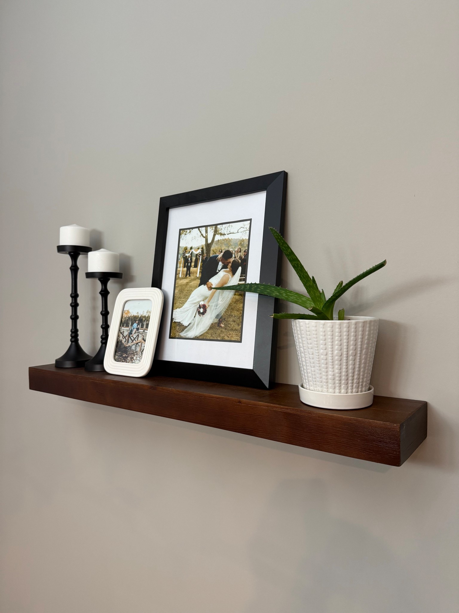 Sharing my floating shelf one last time before changing it over to fall decor!
Floating shelf, home decor, pillar candle, candle holder, picture frames, plant, potted plant, cozy, homey, Target, Pottery Barn

#LTKHome