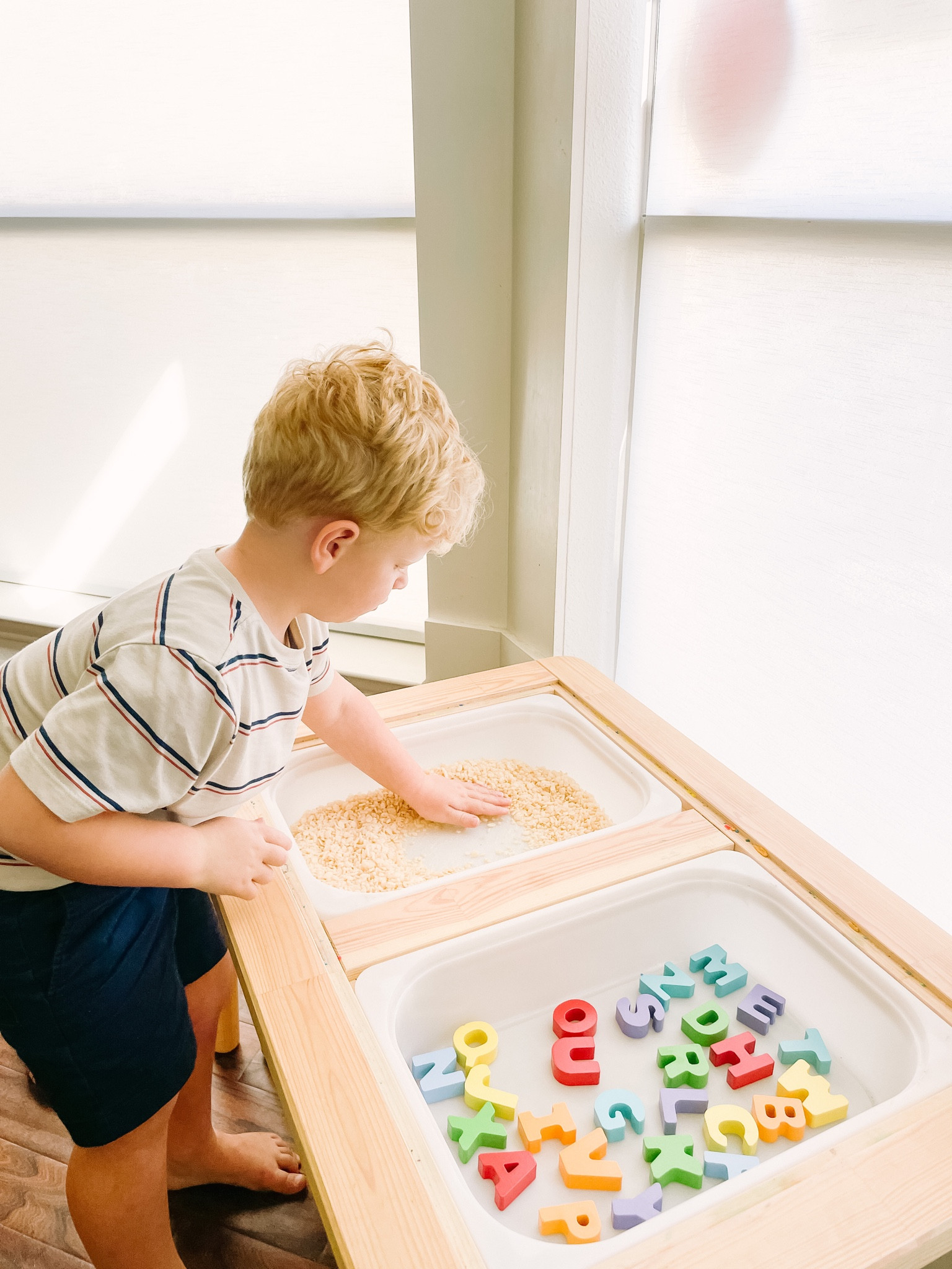 Alphabet play using our cute alphabet puzzle and some stale Rice Crispies 😂