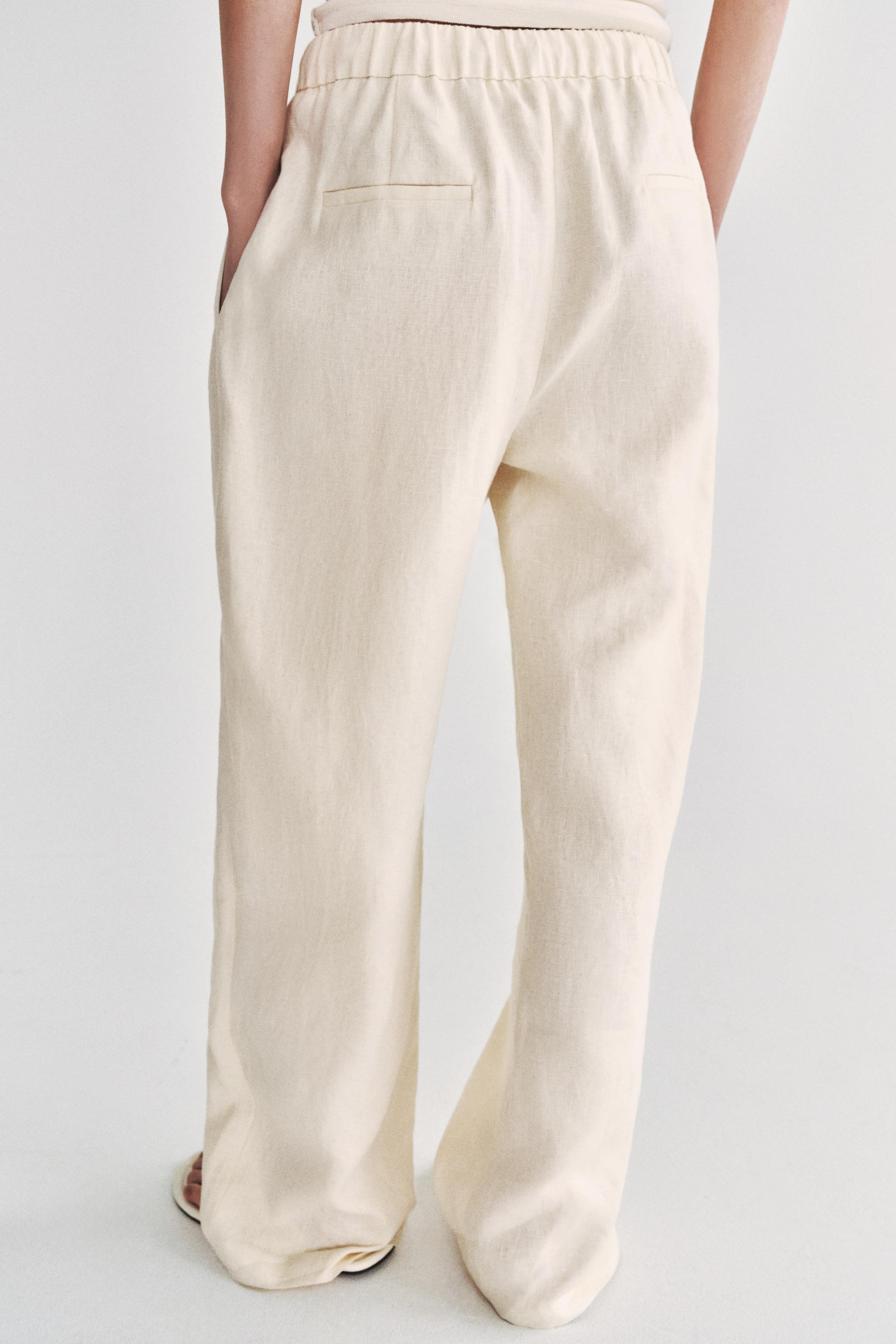 Model height: 178 cmZARA WOMAN COLLECTION. Trousers made from linen yarn. Mid-waist with an adjus... | Zara UK