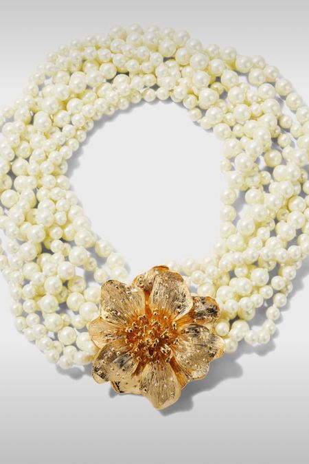 Love this necklace and wearing the gold flower in different places, like front and center, on the side or at the back like a clasp. 