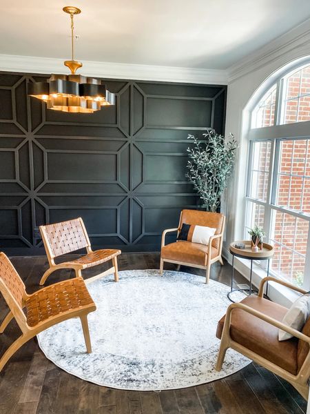 Loving my client’s black accent wall in their new bar room / den!

The Foundry black chandelier is also available in gold and silver. 

Faux leather chair, accent chair, wooden chair, mid century modern chair, artificial tree, artificial olive tree, round area rug, round end table, wooden side table, two toned end table, black metal end table, iron chandelier, contemporary chandelier, gold leaf chandelier, light fixture, living room furniture, den, black.

#furniture #chandelier #chair

#LTKFind #LTKhome #LTKstyletip