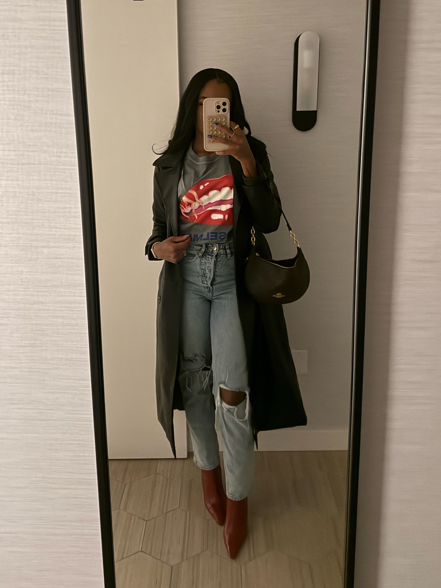 Outfit of the night for a NBA game. This faux leather trench was a steal from Nordstrom Rack! Paired it with red boots, light blue jeans, and a graphic tee. I’m wearing a size xs. 

#LTKSeasonal #LTKStyleTip #LTKShoeCrush