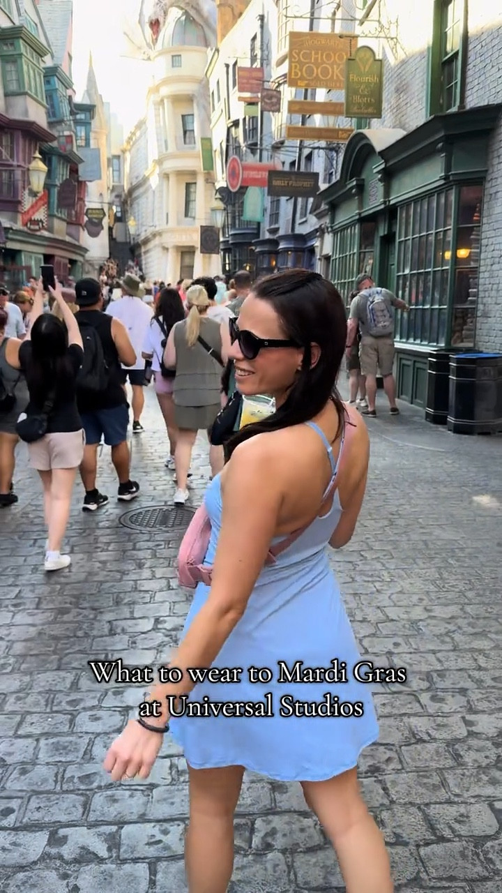 Let the good times roll ⚜️🎶 and stay comfortable in the heat, all the walking (and dancing to AJ McLean and Joey Fatone!), riding rides, eating, and bead catching. 

What I wore to Universal Studios Mardi Gras: 

👗 Lightweight tennis dress with built in shorts
👟 The most comfortable sneakers 
🎒 Belt bag to be hands free

How do you beat the heat while staying comfy yet also stylish for a festival? 

#LTKTravel #LTKootd #LTKActive