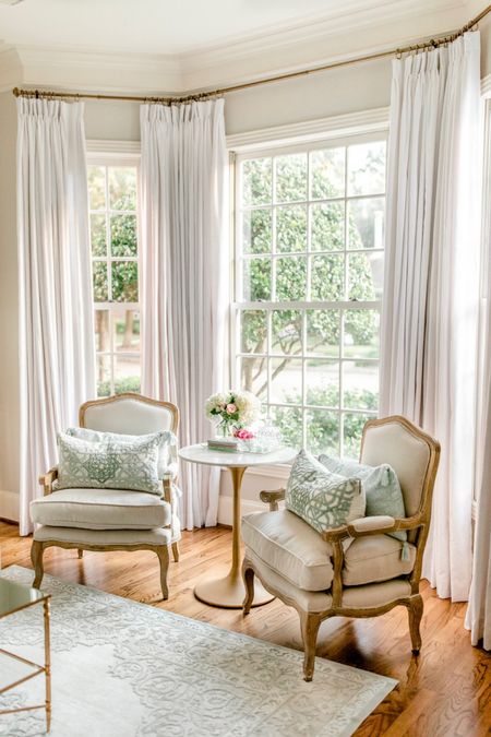 Bay window custom draperies (see my Instagram/blog for all details) French linen accent chairs velvet pillows affordable rug marble top bistro table 

#LTKstyletip #LTKhome #LTKFind
