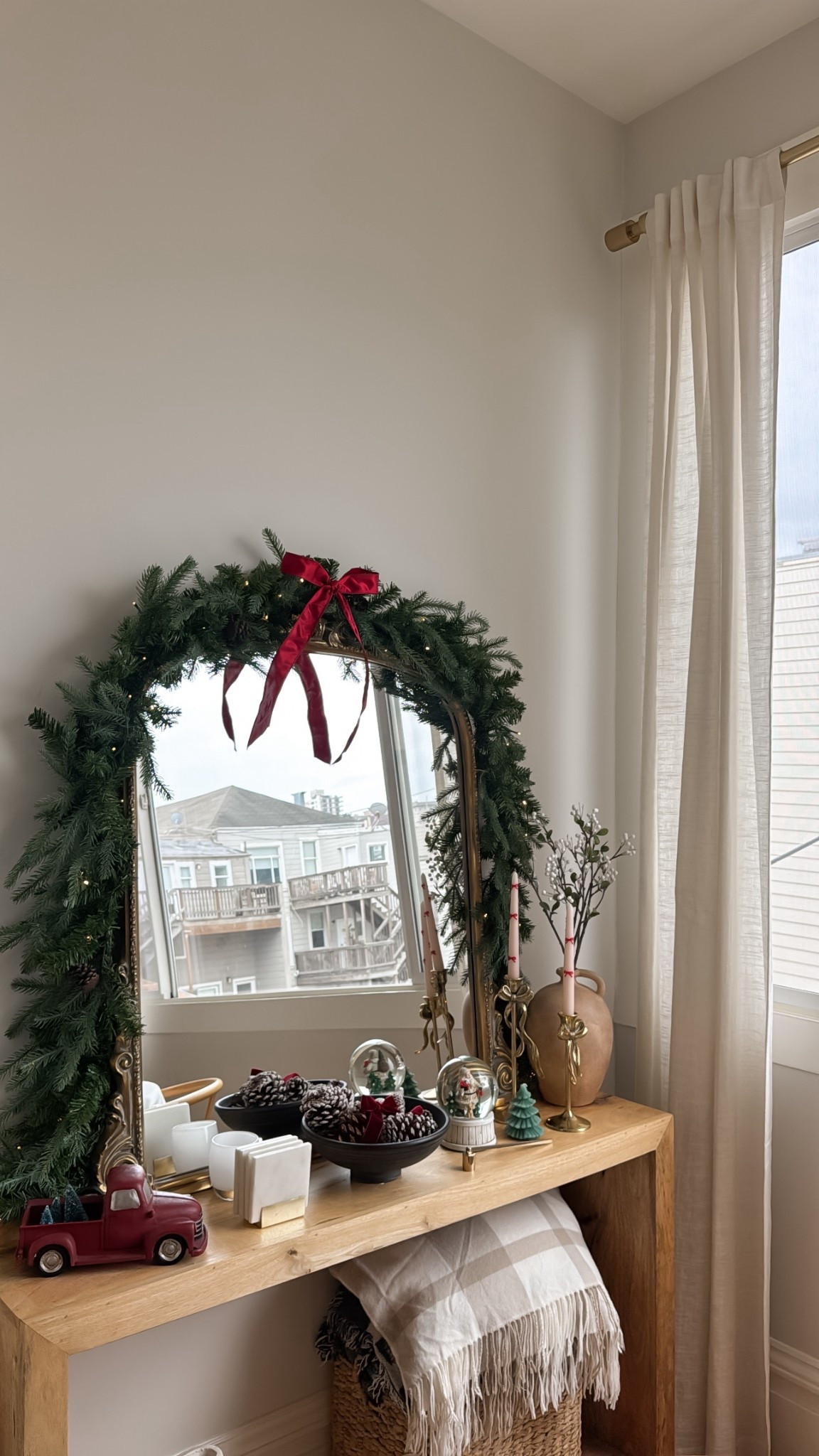 Decorated the dining room console table 😍 feeling festive! I got this new garland this year and liking it so far! It’s a lot fuller than the old one I had and less flimsy - not too badly priced. The 9 ft draped perfectly on my 3 ft mirror from Anthro 

#LTKHoliday #LTKHome