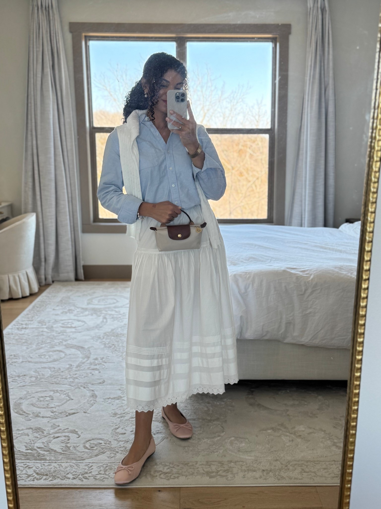 White skirt outfit with blue button down, pink ballet flats, white sweater, and Longchamp bag 

#LTKootd