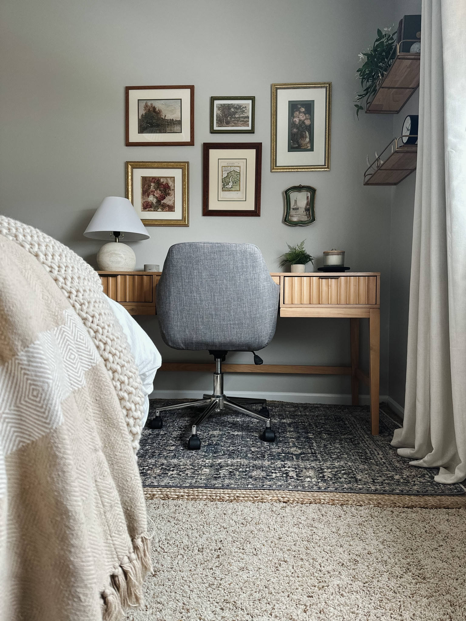 Guest bedroom home office, Jean Stoffer Loloi rug, jute rug, layered rugs, casaluna throw, grey desk chair, modern desk chair, scalloped desk, gallery wall, Etsy art, brass and wood shelves, faux plant, home decor, studio McGee, target decor, desk lamp

#LTKstyletip #LTKhome