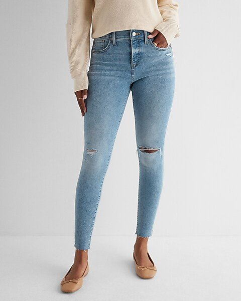 Mid Rise Light Wash Ripped Raw Hem Skinny Jeans | Express