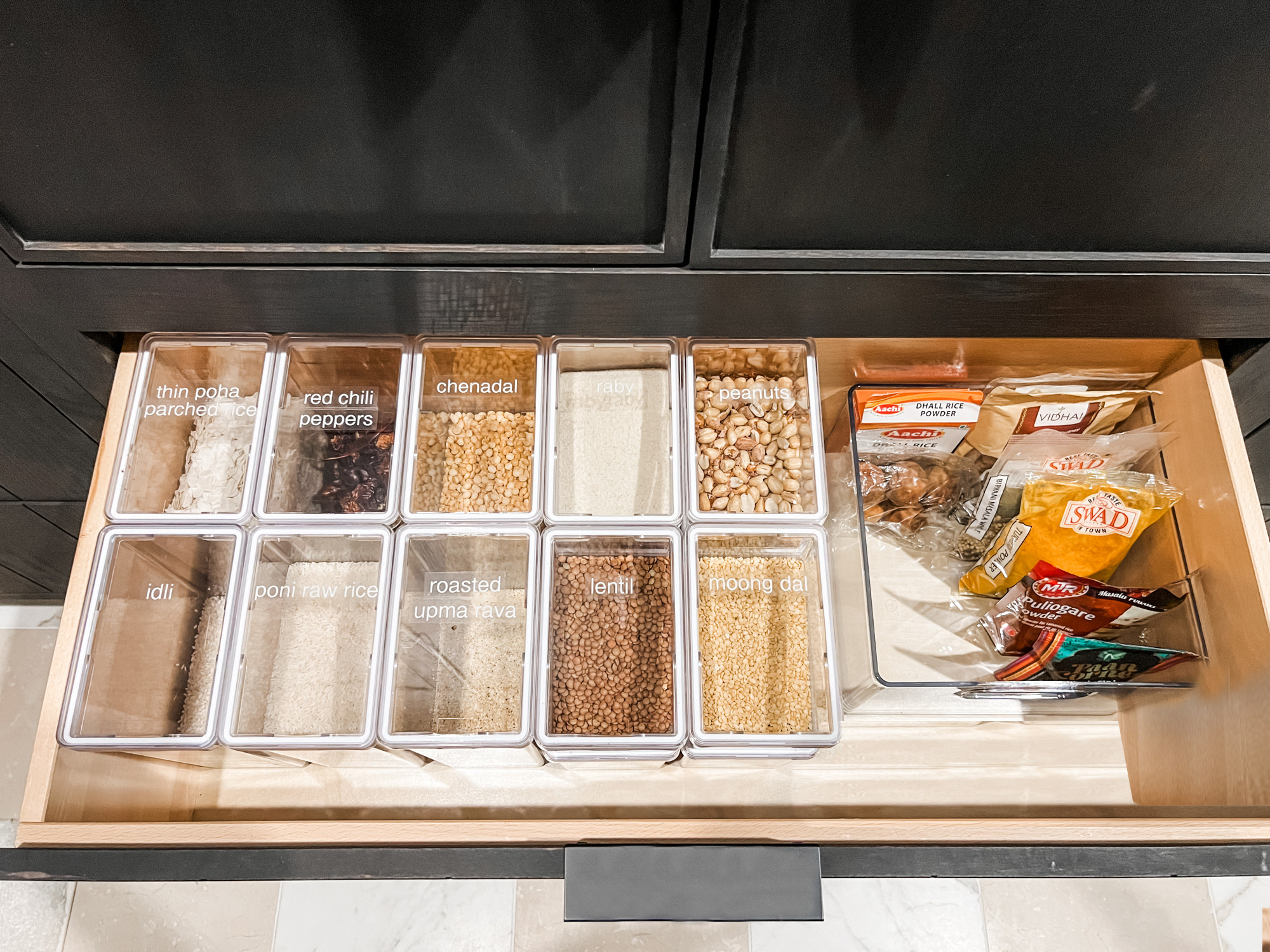 If you find yourself cooking a certain type of cuisine, sometimes it's best to just lean in and dedicate a whole drawer to it! We love using these clear-topped containers so that it's instantly visible what needs to be restocked.

Give us a shout if your pantry needs a little afs love! 

 