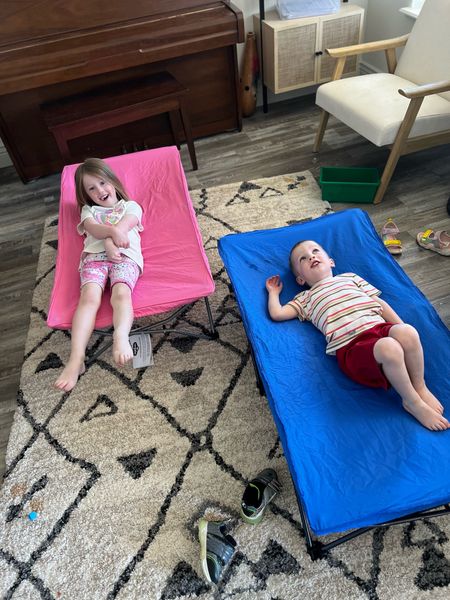 Travel cots for toddlers. Got a blue and pink one for the kids. Folds nicely and fits in a checked bag. 

#LTKKids #LTKVideo #LTKTravel