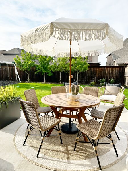 Outdoor meals with the family on the patio just got a lot better with this round wooden table and wicker modern chairs.

#LTKhome #LTKFind #LTKSeasonal