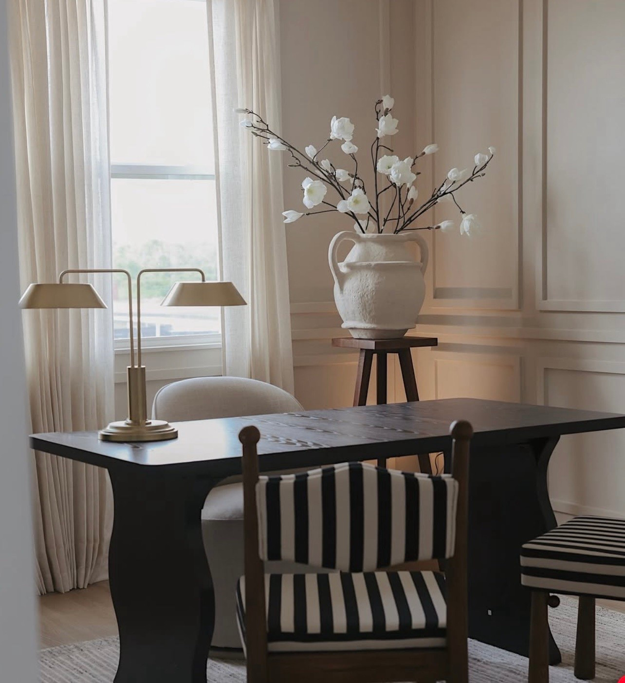 Modern home inspiration. Office design. Dining room vibes. Dark and light contrast. Textured cream terracotta vase. Black and white striped dining chair. Double brass desk table lamp.

#LTKHome