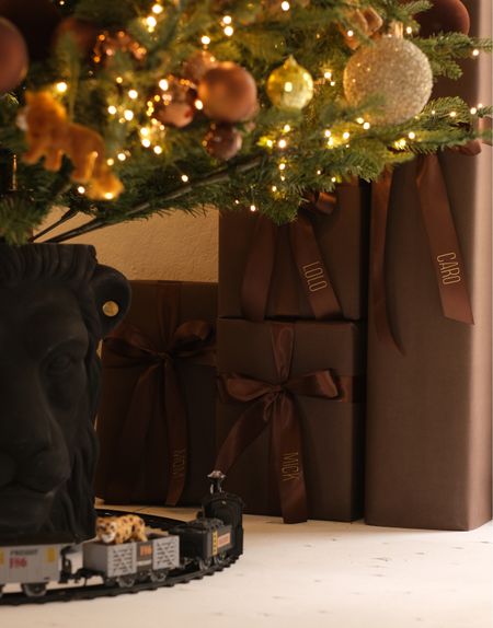 Brown wrapping paper with brown ribbon and gold sticker gift tags! #meandmrjones 

#LTKhome #LTKHoliday #LTKfindsunder50