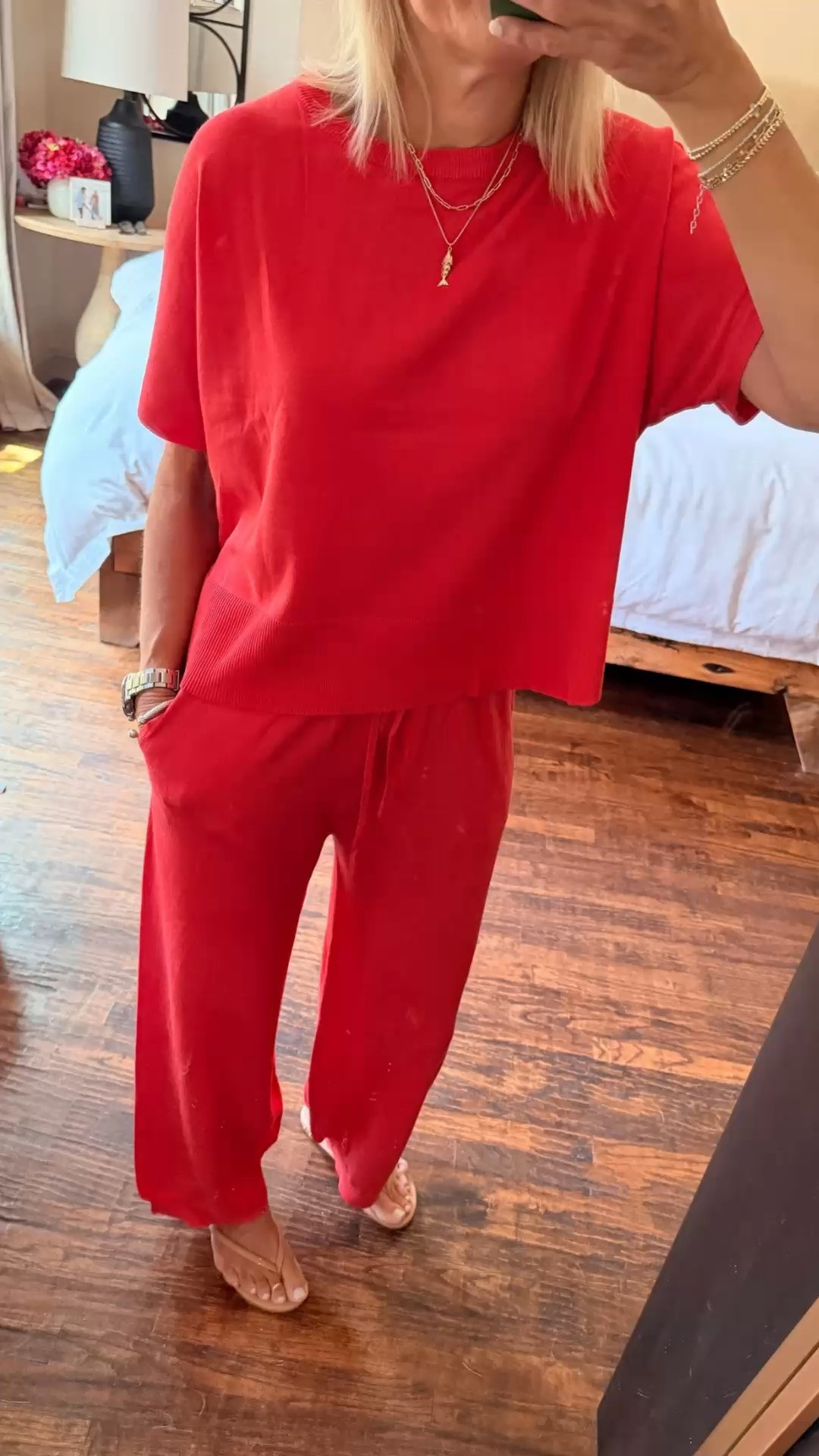This set is so good. ❤️ The red is such a beautiful color, and the lightweight sweater fabric makes it incredibly comfortable. I’m wearing a small and find it true to size. I especially love the wide waistband and pull-on, slightly barrel-leg pants, they’re easy enough for lounging at the beach house but polished enough to wear out with sandals. This one is definitely going in my bag for our next getaway.

💡 LTK MADE EASY
❤️ Heart = Support my posts!
🔖 Save = Get sale & restock alerts
📋 Lists = Keep favorites organized
📲 Share = Send lists and products to a friend. Hello, Christmas List!
💬 Comment = Ask me anything about what I’m wearing.:-)

#LTKootd #LTKOver40