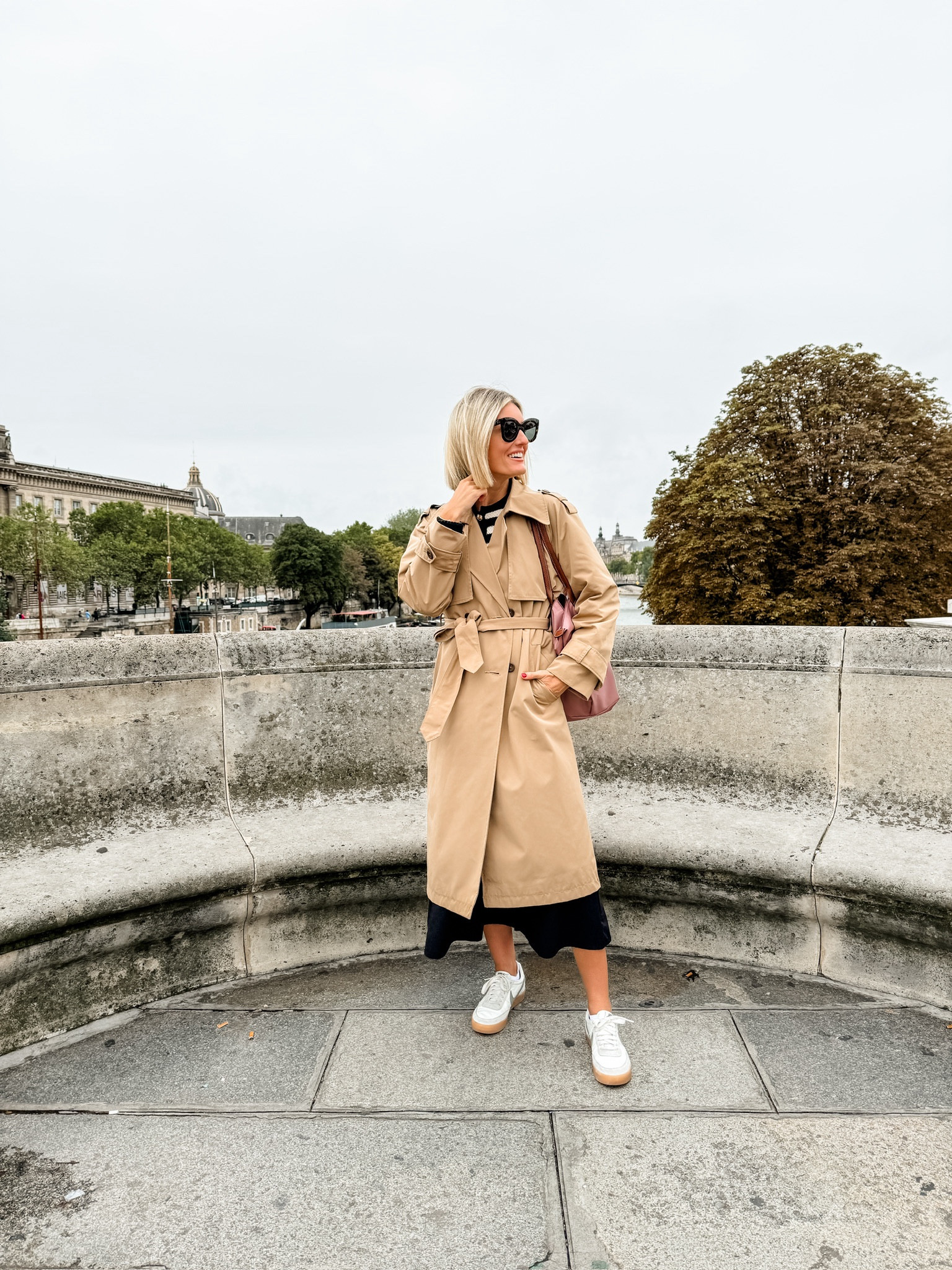 This trench coat from Abercrombie was on repeat for me in Paris! Perfect for the fall! Wearing XS in cardigan & coat! Wearing S in dress! 

Loverly Grey, Paris outfits, Europe outfits, trench coat, fall outfits, fall looks, black midi dress, black dress, striped cardigan, tote bag 

#LTKTravel #LTKSeasonal #LTKStyleTip