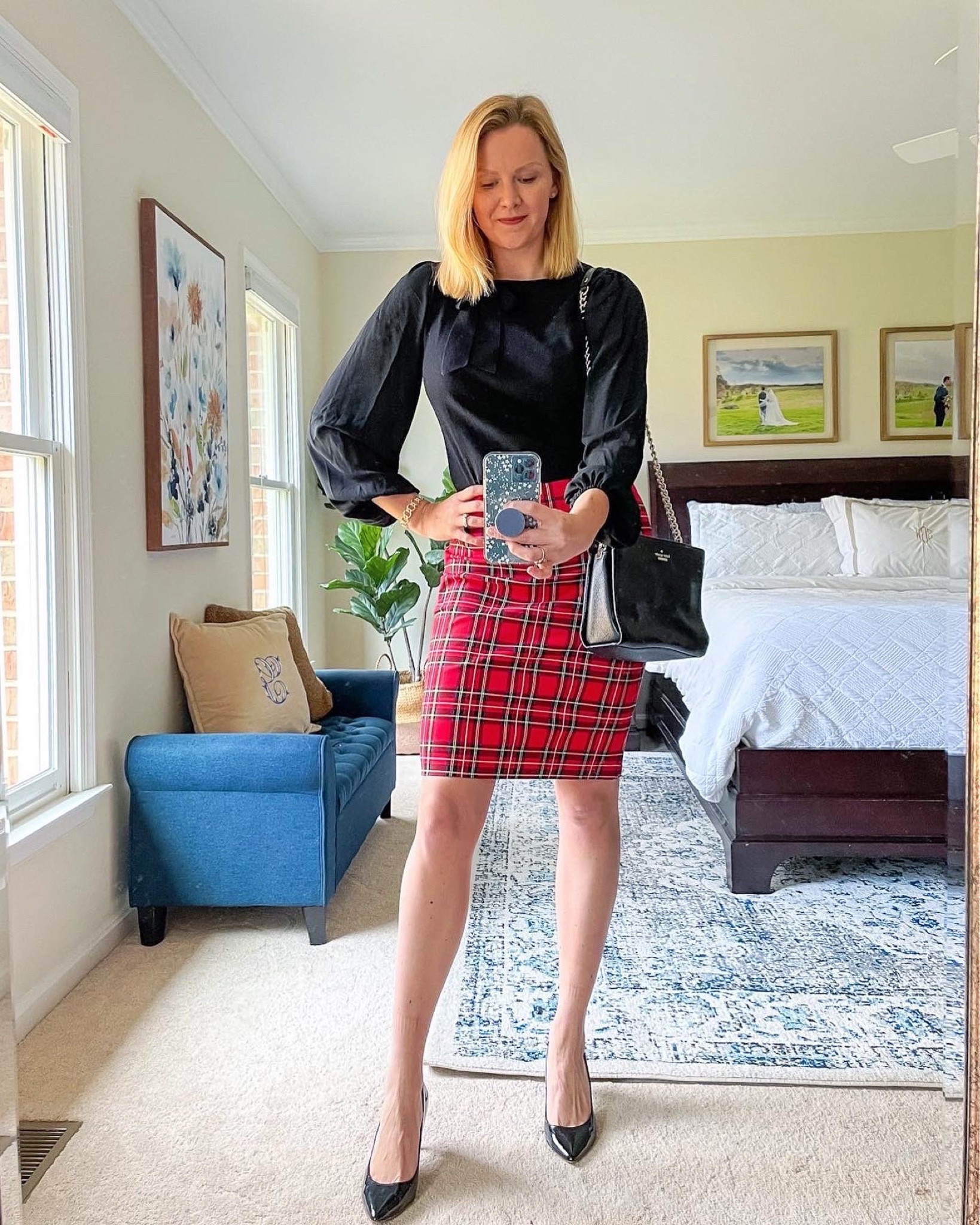 Holiday outfit idea Black long sleeve blouse with short red holiday plaid skirt

Outfit for holiday work party