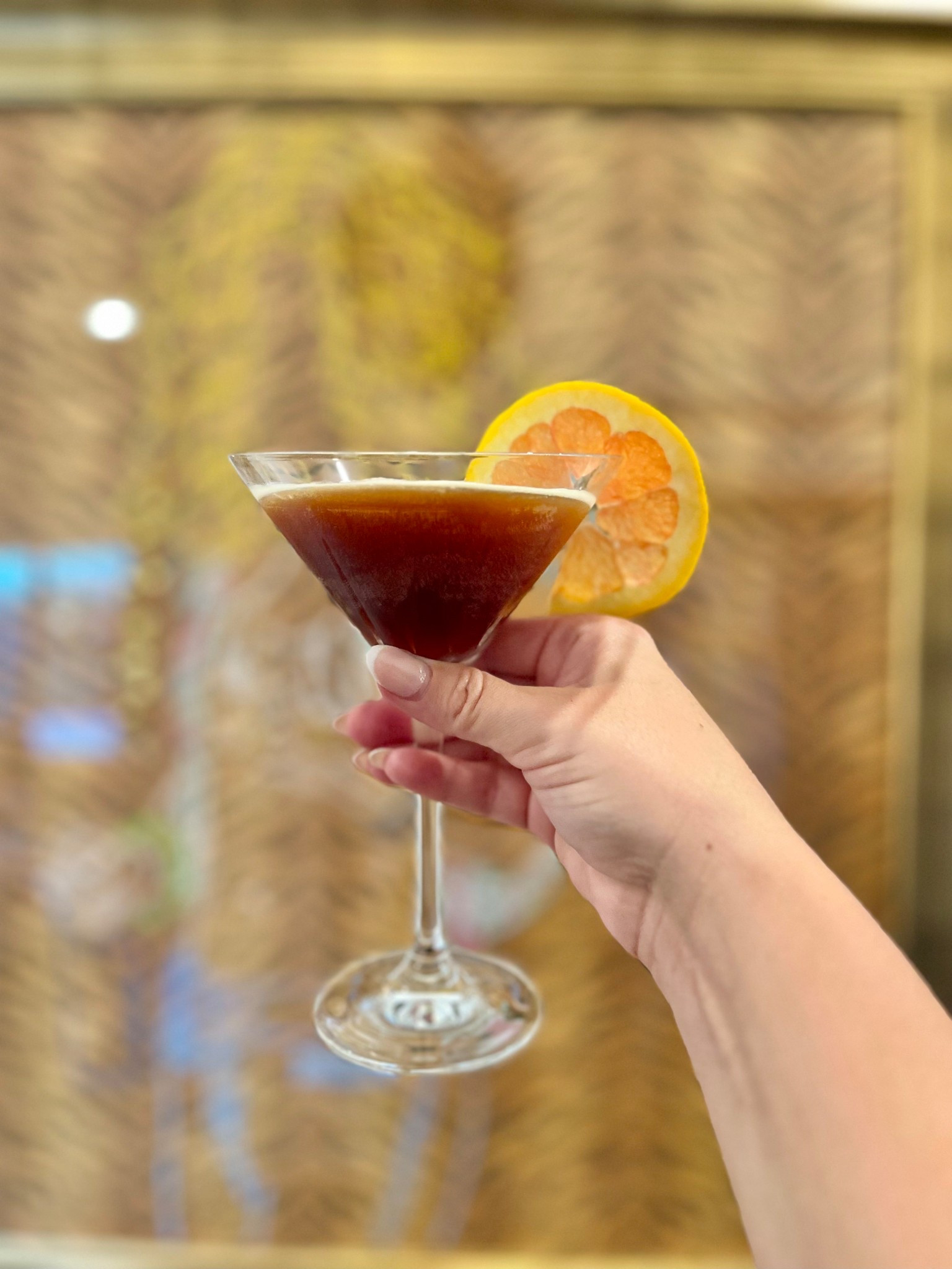 Espresso Martini 
2oz orange flavored vodka 
1oz fresh espresso 
.75oz Kahlúa
Shake over ice, strain, garnish with an orange and serve. 