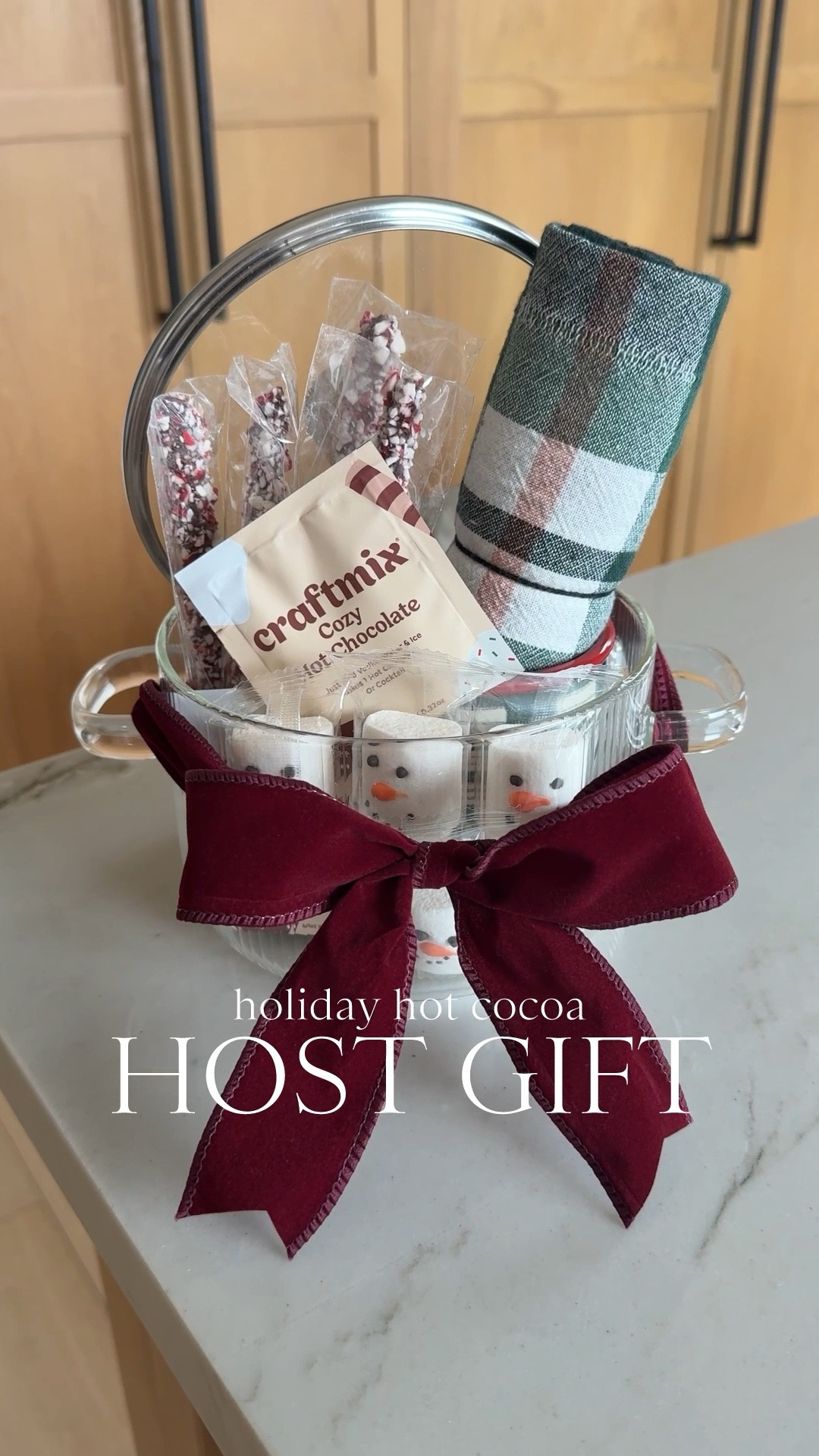 GIFT \ host holiday hot cocoa setup☕️🍫🤶🏻 A festive DIY that anyone would love to revive this season💫 Here’s what I used👇🏻
+ glass pot
+ holiday mug
+ festive tea towel
+ marshmallows 
+ drink peppermint stirrers
+ cocoa mix 
+ velvet bow 

#LTKParties #LTKHome #LTKHoliday