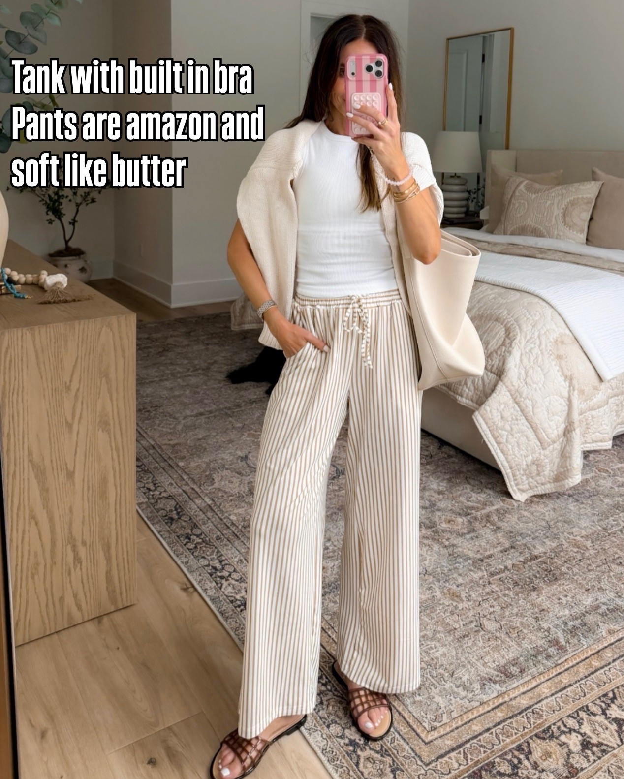 This outfit checks every box for me. The tank has a built in bra so there’s no layering required, and these striped pants are unbelievably soft with the perfect relaxed fit. An easy outfit for travel days, errands, lunch with friends, or just looking put together with minimal effort.

Built in bra tank, Striped pants, Amazon fashion finds, Neutral outfit, Travel outfit, Casual chic style, Comfortable summer outfit, Everyday essentials, Capsule wardrobe, Resort wear, Wide leg pants, annabrstyle

#LTKootd #LTKSeasonal #LTKSaleAlert