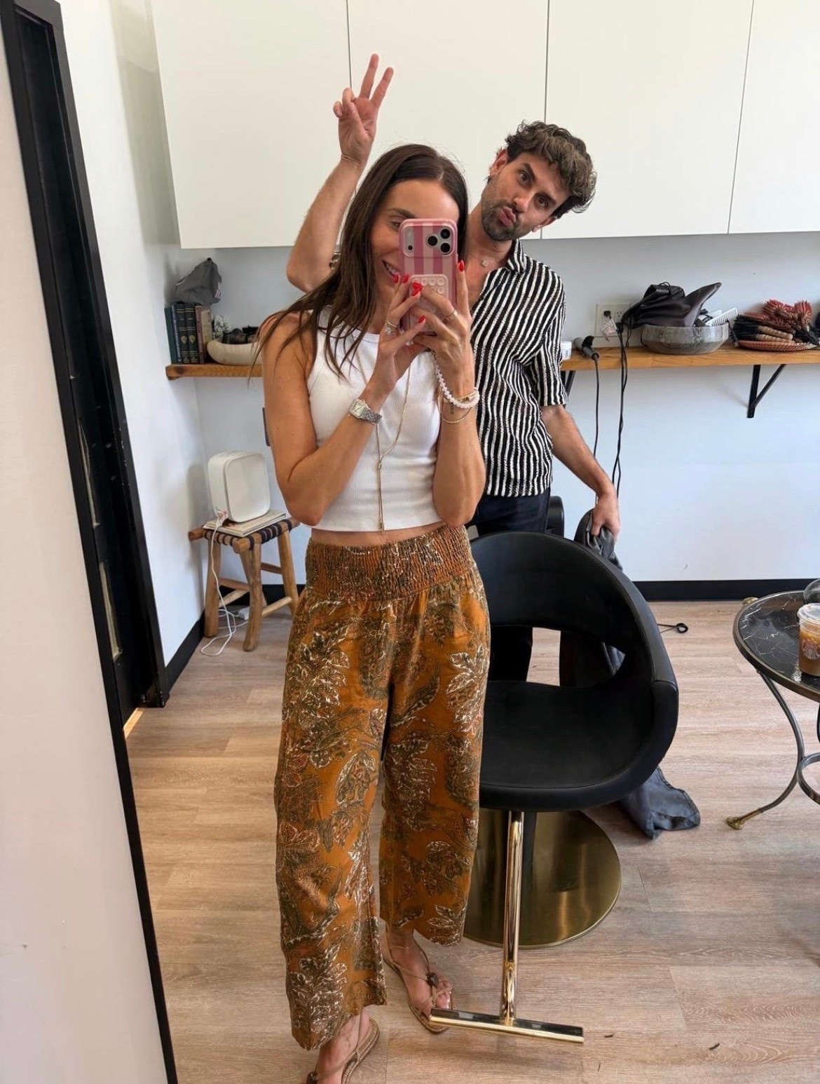 These printed pants are the kind of piece that makes getting dressed more fun. The wide smocked waistband sits comfortably without digging in, and the lightweight fabric has an easy drape through the leg. I kept the rest simple with a fitted white tank so the warm floral print could be the focus.

printed wide leg pants, smocked waist pants, floral pants, lightweight summer pants, white tank outfit, relaxed vacation style, boho summer outfit, comfortable statement pants, casual dinner outfit, annabrstyle

#LTKdayinmylife #LTKootd #LTKOver40