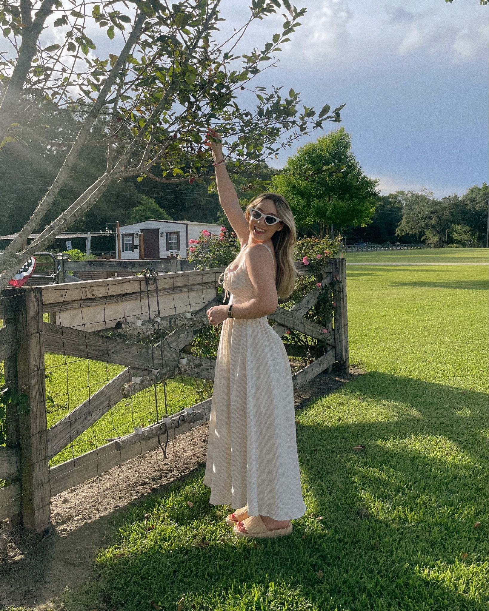 Summer at the acres 🫶🏼💛 sold out in the striped but still available in WHITE - wearing a small 

#summerdresses #anthropologie #myanthro #stevemadden 

#LTKPetite #LTKSeasonal #LTKSummerEdit