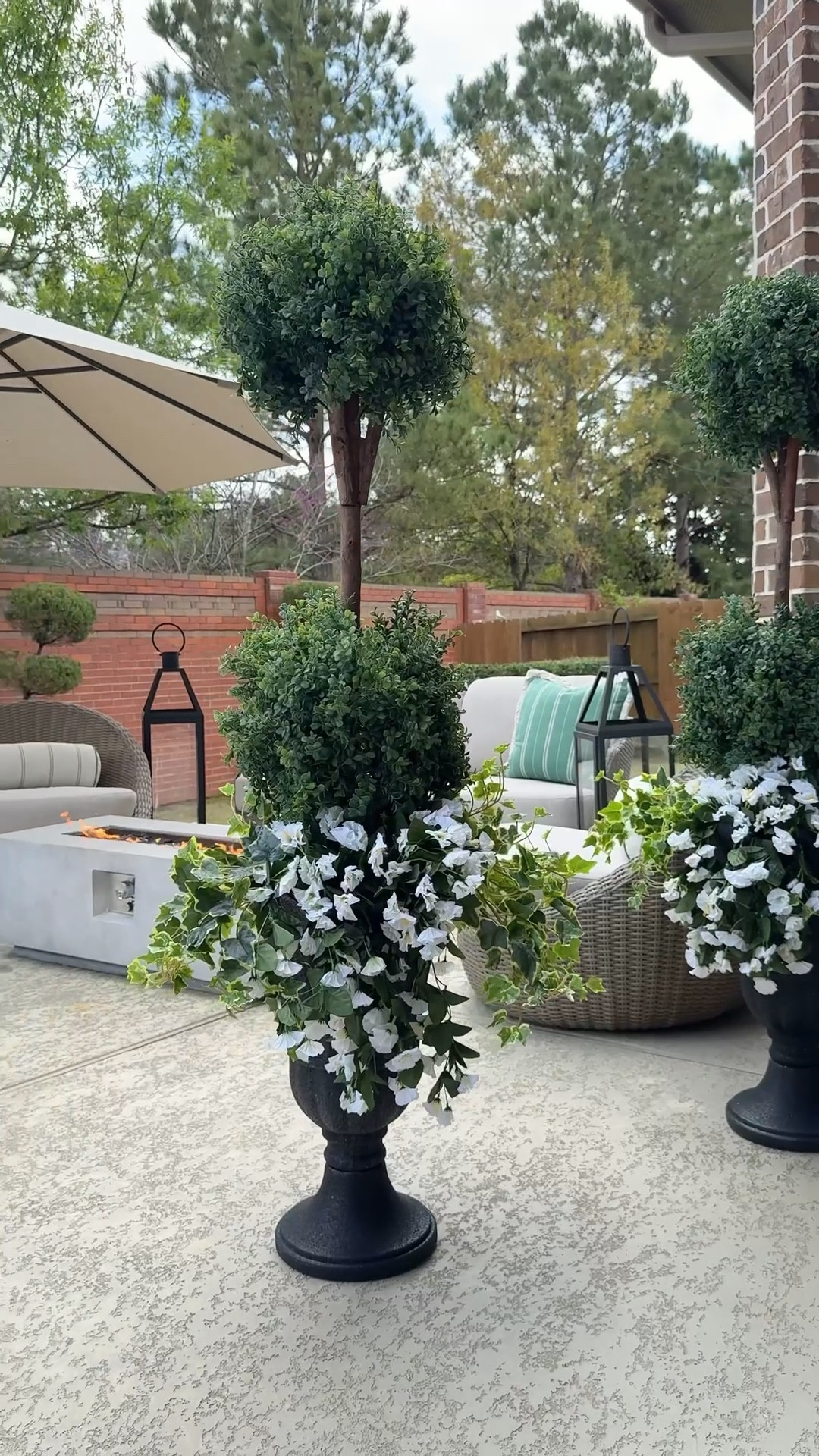Pinterest made me do it 
Recreated this elevated topiary planter look with faux greenery + cascading ivy for a full outdoor styling moment. Zero maintenance but such high impact for a patio, porch, or entry.

#LTKHome #LTKSeasonal