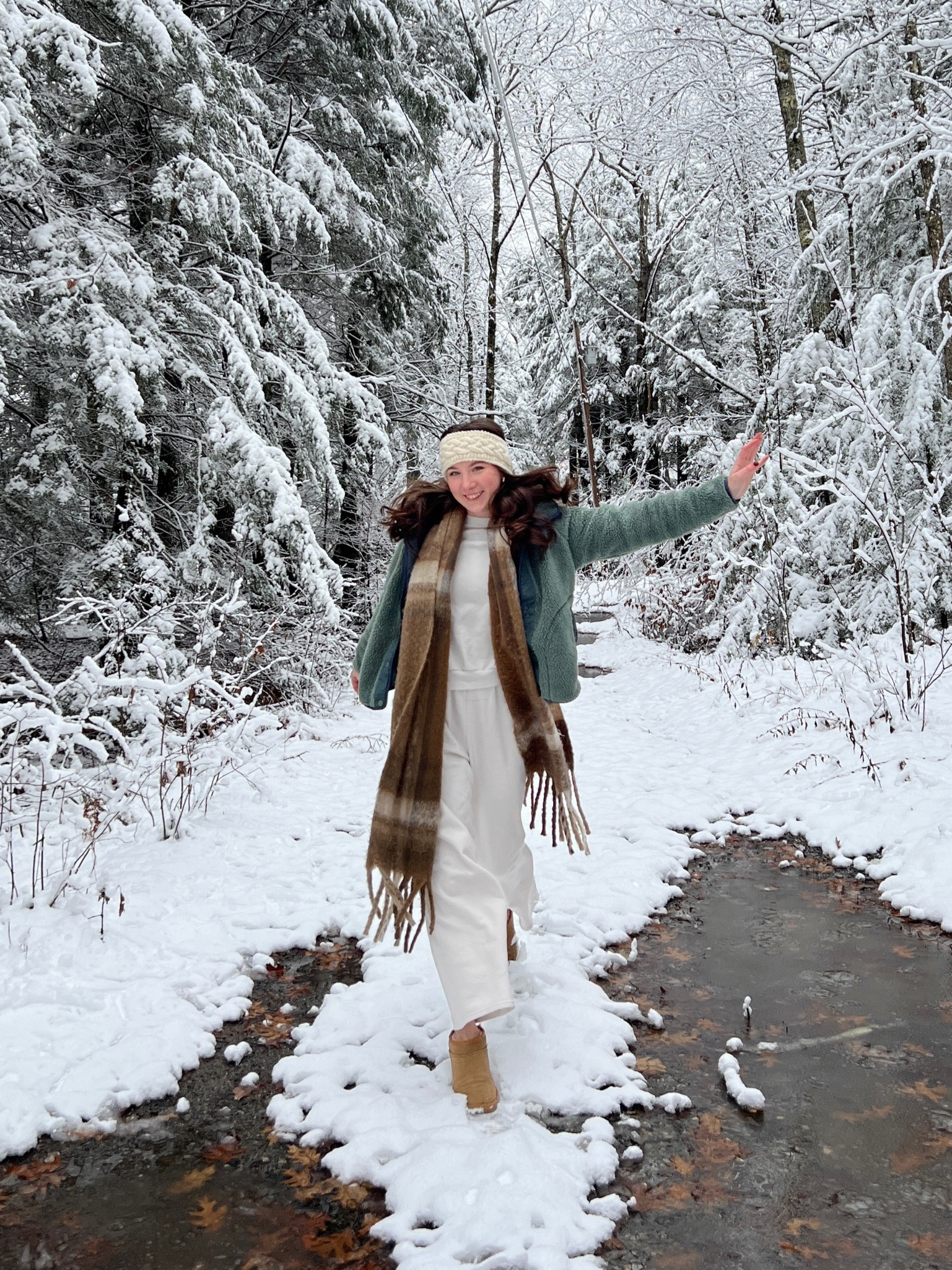 Snow day outfit. Matching cream sweatpants and crew neck set, with Uggs, green fleece, and long scarf

