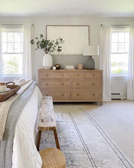 Pottery Barn dresser, vase, drapes, faux stems, rug, wood bench, bedding, modern coastal bedroom 

#LTKhome #LTKstyletip