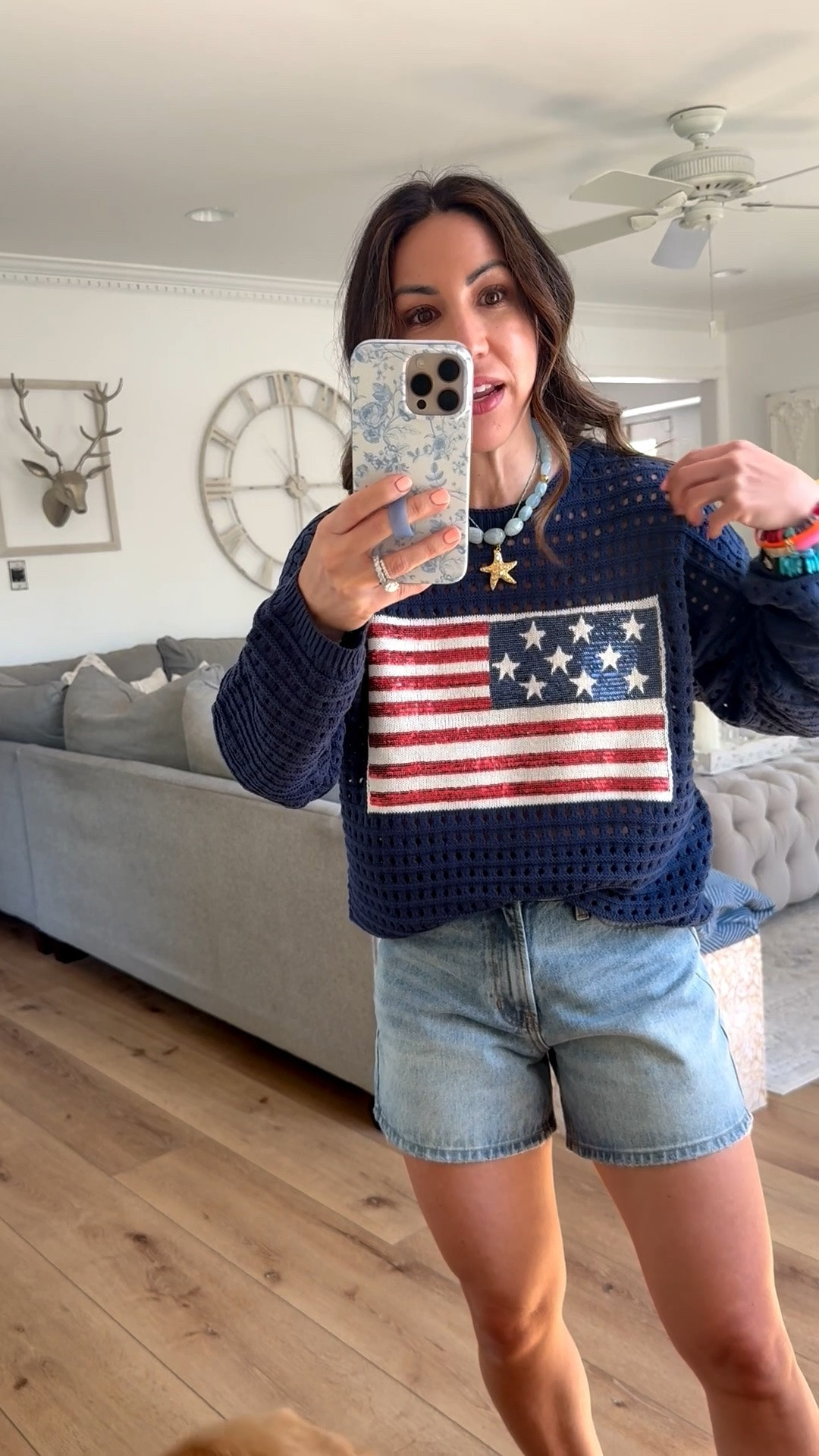 Small flag sweater. Small denim shorts.

#LTKOver40